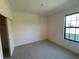 Bright bedroom with large window and private closet at 8191 Varenna Dr, Sarasota, FL 34231