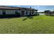 House exterior showcasing a front entrance and well-manicured lawn at 8191 Varenna Dr, Sarasota, FL 34231