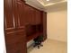 Home office with built-in desk and extensive cabinetry at 8191 Varenna Dr, Sarasota, FL 34231