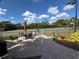 Tennis court with seating area and shade umbrella at 8191 Varenna Dr, Sarasota, FL 34231