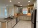 Modern kitchen with granite countertops and stainless steel appliances at 8191 Varenna Dr, Sarasota, FL 34231