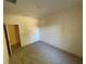 Simple bedroom with neutral decor and closet at 8191 Varenna Dr, Sarasota, FL 34231