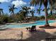 Relaxing community pool with lounge chairs at 8191 Varenna Dr, Sarasota, FL 34231