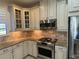 Modern kitchen features granite countertops, stainless steel appliances, and ample cabinetry at 8191 Varenna Dr, Sarasota, FL 34231