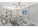 Open living room with view into kitchen and coastal decor at 1801 Gulf N Dr # 204, Bradenton Beach, FL 34217