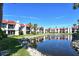 Condo building exterior showcasing a balcony and waterfront view at 1801 Gulf N Dr # 204, Bradenton Beach, FL 34217