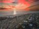 Breathtaking aerial view of beachfront property with colorful sunset sky and ocean views at 1055 Beach Rd # B-302, Sarasota, FL 34242