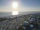 Aerial view of coastline, beach, and community at 1055 Beach Rd # B-302, Sarasota, FL 34242