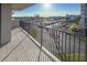 Balcony featuring views of community landscaping, a canal, and distant ocean at 1055 Beach Rd # B-302, Sarasota, FL 34242