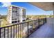 Balcony view of the building's facade, showing the balcony's iron railing at 1055 Beach Rd # B-302, Sarasota, FL 34242