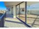 Tiled balcony providing a view of the light-filled living area and the community beyond at 1055 Beach Rd # B-302, Sarasota, FL 34242