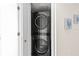 Stacked LG washer and dryer in a closet at 1055 Beach Rd # B-302, Sarasota, FL 34242