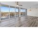 Spacious living room with floor-to-ceiling windows offering panoramic views of the surrounding landscape at 1055 Beach Rd # B-302, Sarasota, FL 34242