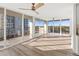 Bright living room with hardwood floors and sliding glass doors leading to a balcony with a city view at 1055 Beach Rd # B-302, Sarasota, FL 34242