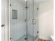 Walk-in shower with glass enclosure and mosaic tile floor at 1055 Beach Rd # B-302, Sarasota, FL 34242