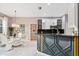 Elegant dining area with a glass table and modern chandelier at 1503 Evangelina Ln, North Port, FL 34286