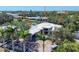 An aerial shot of the home showcasing the home's roof, landscaping, and desirable neighborhood at 1802 Field Rd, Sarasota, FL 34231