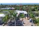 View from above the new home showing light roof, location and nearby homes at 1802 Field Rd, Sarasota, FL 34231