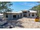 Exterior view of home under construction, showing block structure, windows, and attached garage at 1802 Field Rd, Sarasota, FL 34231