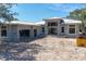 Exterior view of home under construction, showing block structure, windows, and attached garage at 1802 Field Rd, Sarasota, FL 34231