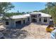 Exterior view of home under construction, showing block structure, windows, and attached garage at 1802 Field Rd, Sarasota, FL 34231