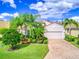 Beautiful one-story house with lush landscaping and brick driveway at 4139 63Rd E Ter, Sarasota, FL 34243