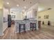 Bright kitchen with white cabinets, black appliances, and granite countertops at 4139 63Rd E Ter, Sarasota, FL 34243
