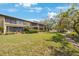Building exterior showcasing manicured lawn and serene waterway at 6435 Egret Ln # 409, Bradenton, FL 34210