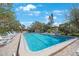 Inviting community pool with lounge chairs, perfect for relaxation at 6435 Egret Ln # 409, Bradenton, FL 34210