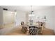 Dining area with glass-top table and four chairs at 6435 Egret Ln # 409, Bradenton, FL 34210