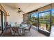 Enjoy this screened porch with glass-top table and chairs overlooking tranquil waters at 6435 Egret Ln # 409, Bradenton, FL 34210