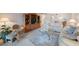 Living room with ample seating and a view into the dining area at 6435 Egret Ln # 409, Bradenton, FL 34210