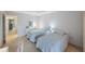 Guest bedroom with two twin beds and private balcony access at 6435 Egret Ln # 409, Bradenton, FL 34210