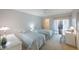 Guest bedroom with two twin beds and a desk at 6435 Egret Ln # 409, Bradenton, FL 34210