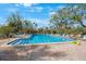 Inviting community pool with lounge chairs for relaxation at 6435 Egret Ln # 409, Bradenton, FL 34210