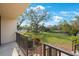 Private patio steps lead to a lush green lawn and tranquil waterway at 6435 Egret Ln # 409, Bradenton, FL 34210