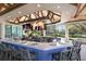 Bar area with open windows, TVs, and comfortable seating at 8223 Regents Ct, University Park, FL 34201