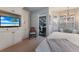 Comfortable bedroom with built-in storage and access to the outdoor patio at 8223 Regents Ct, University Park, FL 34201