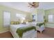 Inviting bedroom featuring twin beds, neutral decor, and lots of natural light at 8223 Regents Ct, University Park, FL 34201