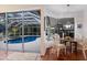 Bright breakfast nook with views of the pool and patio at 8223 Regents Ct, University Park, FL 34201