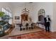 Elegant dining room with chandelier, decorative mirror, and stylish seating at 8223 Regents Ct, University Park, FL 34201