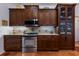Updated kitchen with stainless steel appliances and plenty of cabinet storage at 8223 Regents Ct, University Park, FL 34201