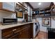 Functional laundry room with ample storage cabinets, countertop space, and modern appliances at 8223 Regents Ct, University Park, FL 34201