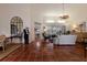 Spacious living room with tile floors, white couch, and access to backyard at 8223 Regents Ct, University Park, FL 34201