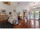 Bright living room with high ceilings, tile floors, and a view of the front entry at 8223 Regents Ct, University Park, FL 34201