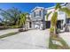 Front view of two-story townhome with gray siding at 8685 Daydream St, Sarasota, FL 34238