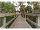 Wooden boardwalk leading to community amenities at 9623 Sea Turtle Ter # 202, Bradenton, FL 34212