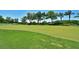 Expansive putting green surrounded by lush landscaping at 6904 Drewrys Blf # 810, Bradenton, FL 34203