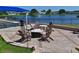 Relaxing patio with fire pit, chairs, and lake view at 6904 Drewrys Blf # 810, Bradenton, FL 34203