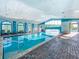 Relaxing indoor pool with large windows and seating at 4139 63Rd E Ter, Sarasota, FL 34243